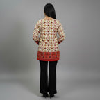 Back view of Entici Siara Ruby Swarovski cotton kurti with ethnic print, flared sleeves, and round neckline