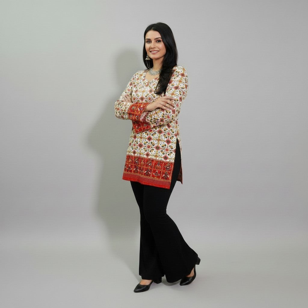 Entici Siara Ruby Swarovski cotton kurti with ethnic print, V-neck, and flared sleeves worn with black trousers.